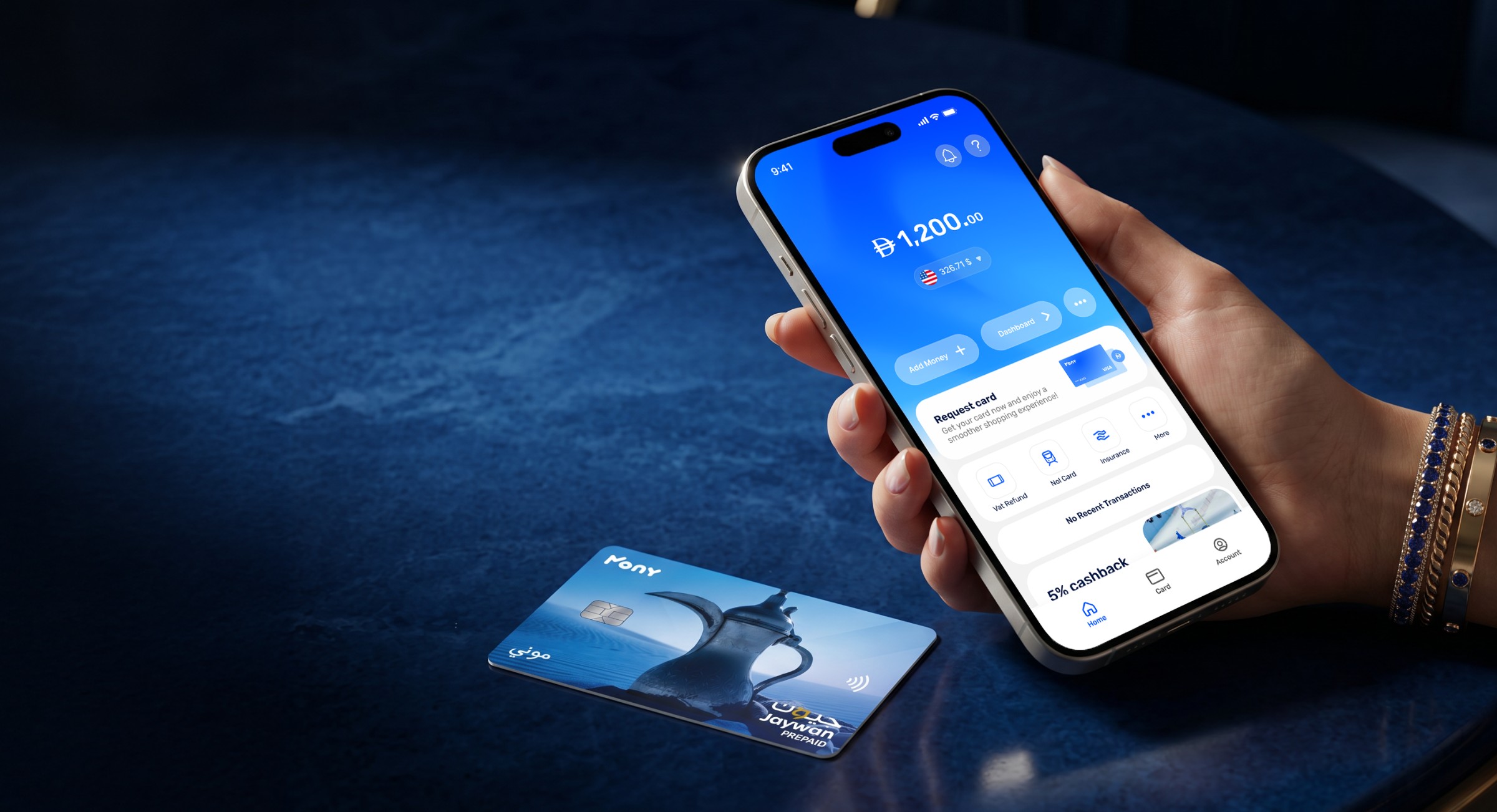 A hand holding a phone with the Mony app next to a Mony Jaywan prepaid card